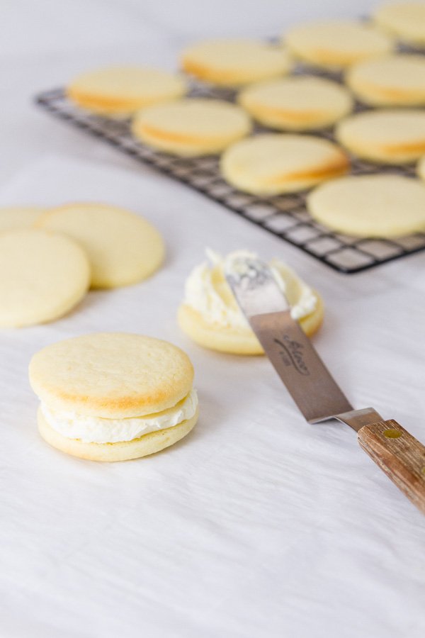 frosting the sandwich cookies
