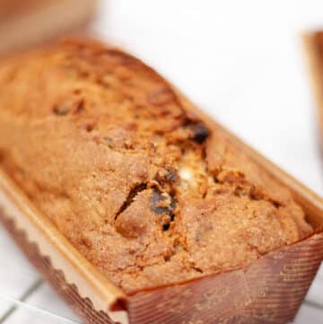 a loaf of bread in a paper loaf pan.