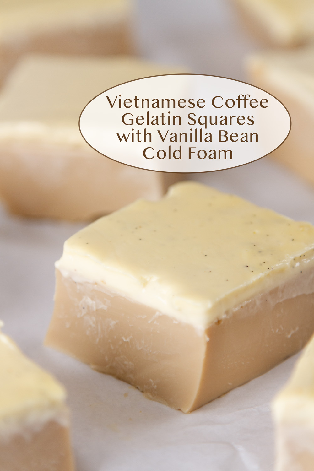 a gelatin square made with creamy coffee and topped with a cream layer cut into a square.