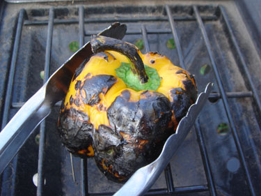 The skin of the pepper is getting nicely blackened Cooking Basics &ndash; Roast a Chili Pepper