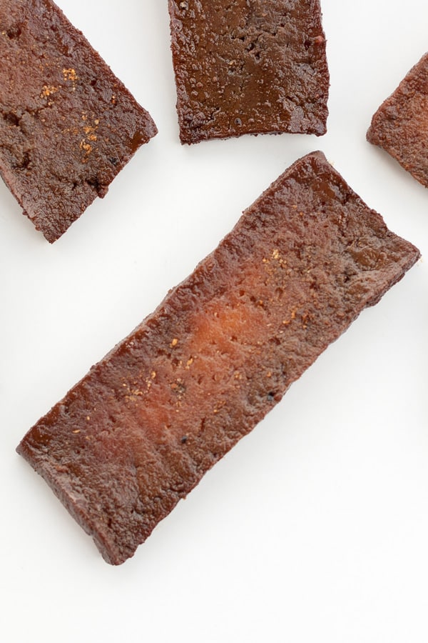pieces of tofu jerky, the one in the center is a little white and raw, and needs to be cooked longer.