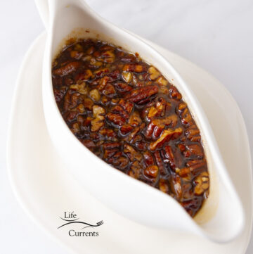 a gravy boat filled with pecan syrup.