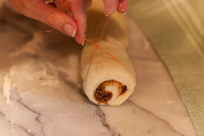 cinnamon rolls with vanilla icing: Cinnamon Rolls, a tutorial for rolling and cutting https://lifecurrentsblog.com #tutorial #howto #cinnamon #breakfast