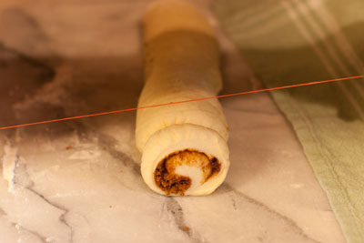 cinnamon rolls with vanilla icing: Cinnamon Rolls, a tutorial for rolling and cutting https://lifecurrentsblog.com #tutorial #howto #cinnamon #breakfast