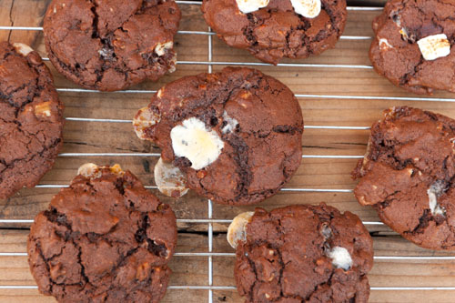 rocky road chocolate cookies looking down on chocolate cookies cooling on a wire rack.