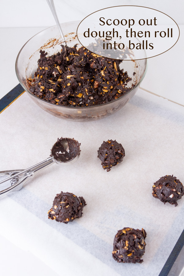 scooping cookie dough onto a baking sheet.