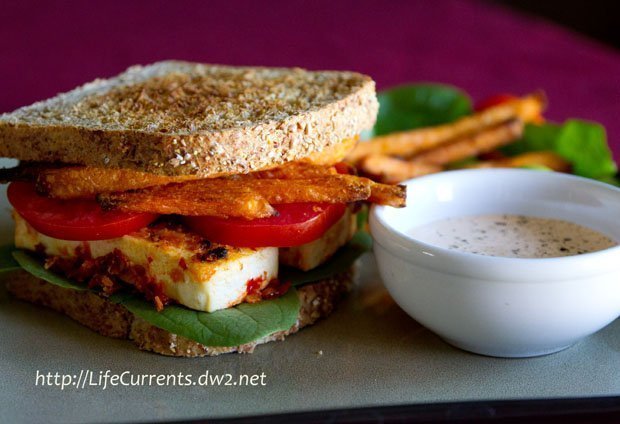 spicy crispy tofu sandwich: With fresh spinach, tomatoes, sweet potato fries, and chipotle-sour cream sauce on toasted sprouted 7-grain bread vegetarian lifecurrentsblog.com