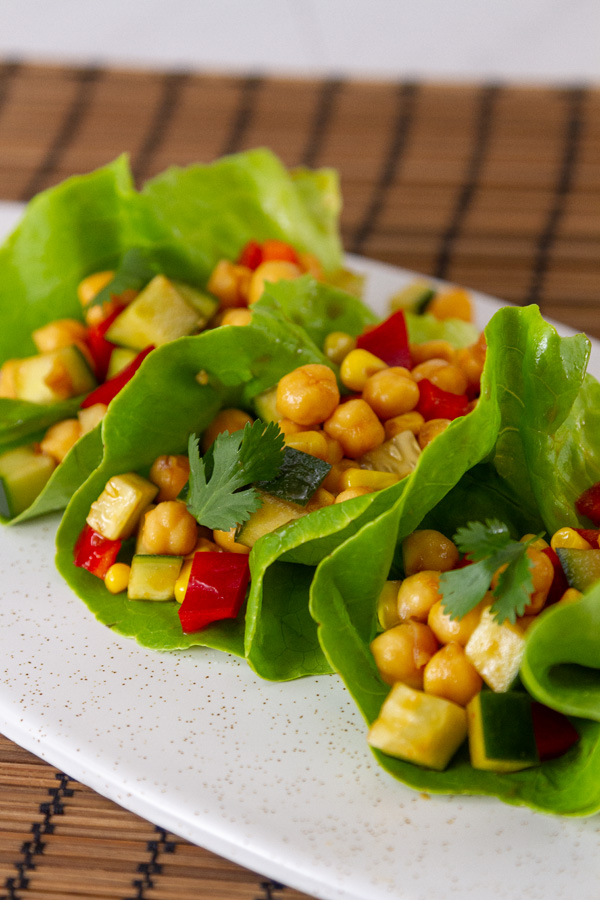 lettuce wraps filled with chickpeas, red pepper, cucumber, cilantro.