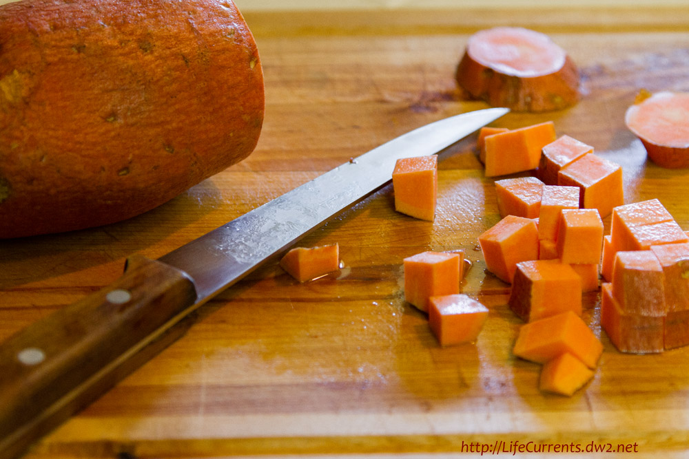 cutting Sweet Potatoes with a knife.