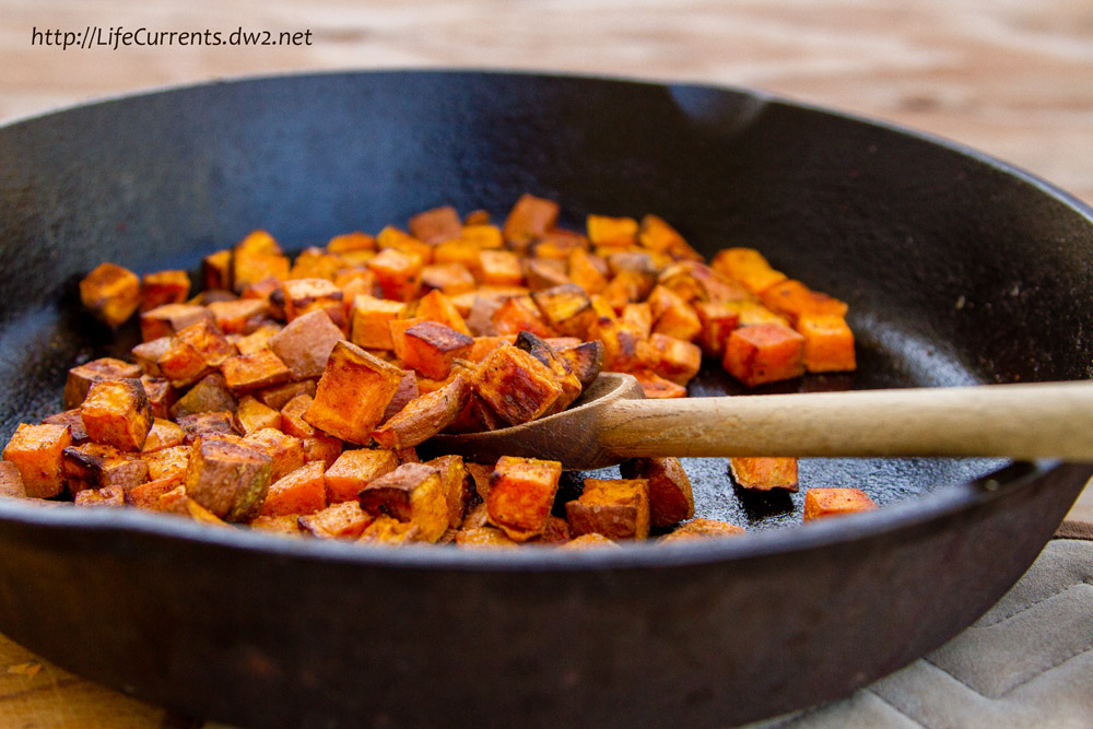 cooked sweet Potatoes in a skillet.