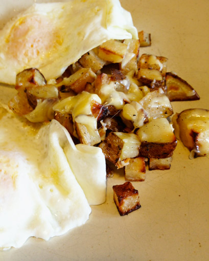 Roasted russet Potatoes with an egg.