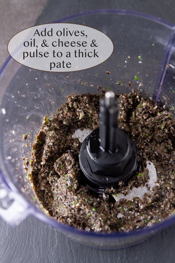 pureeing black olives and seasonings in a food processor.