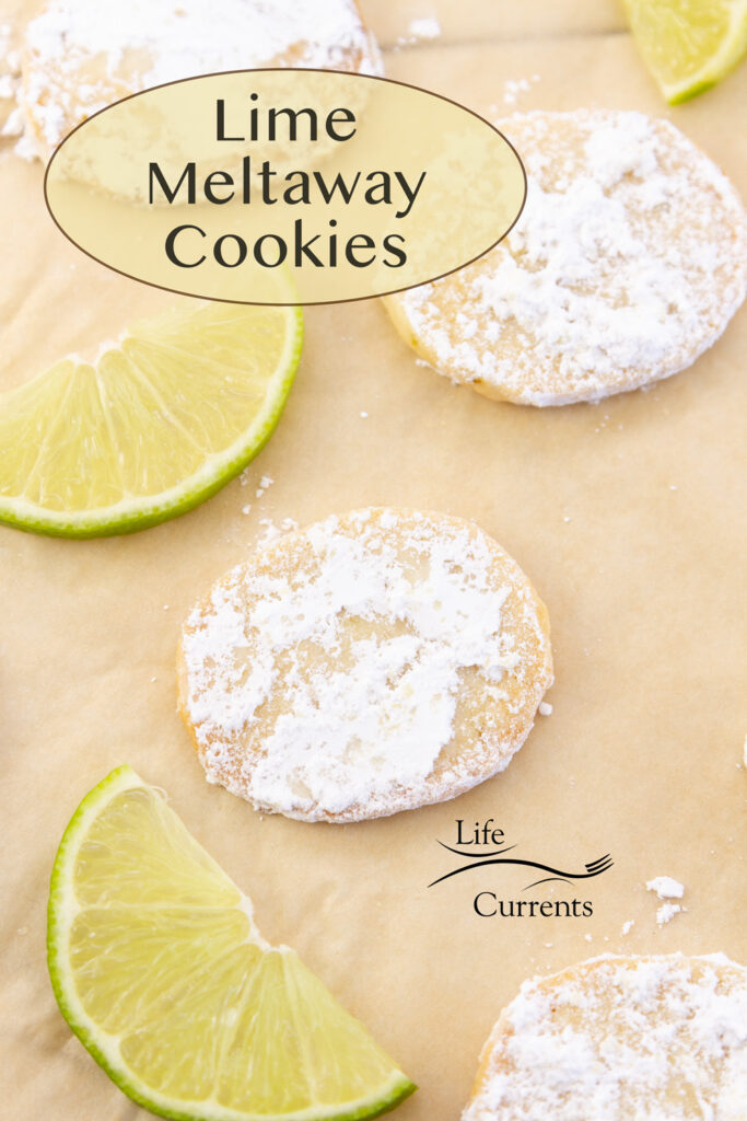 Lime Meltaway Cookies on parchment paper with slices of lime, title in upper left.