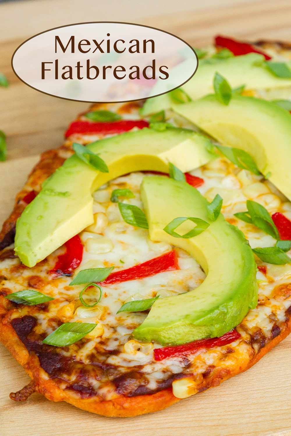 a Mexican flatbread on a wooden cutting board.