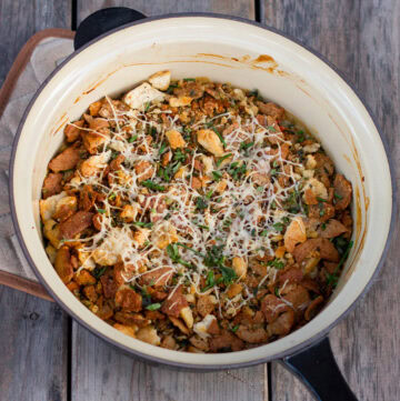 Looking down into a casserole dish with with vegetation casserole topped with bread crumbs.
