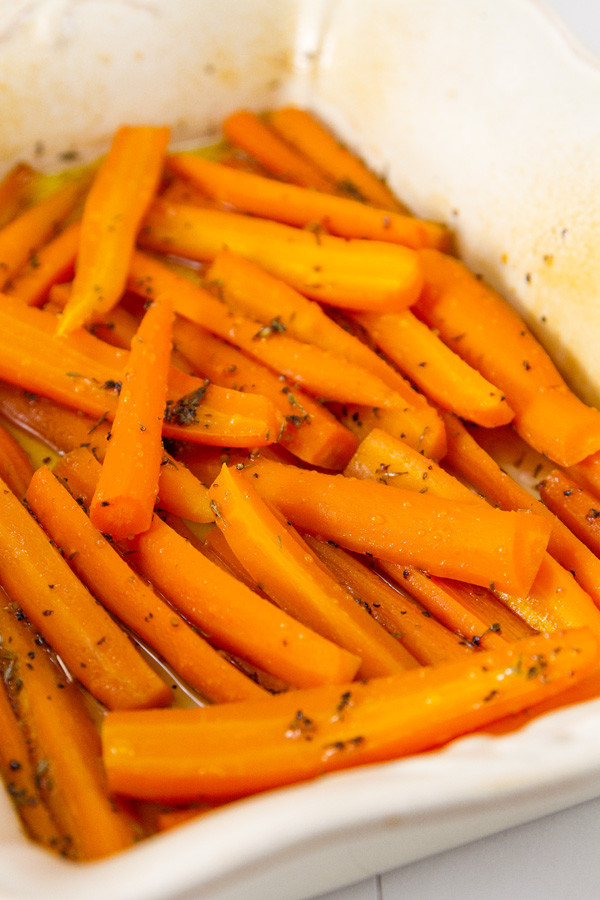 cooked carrots in the roasting dish just out of the oven