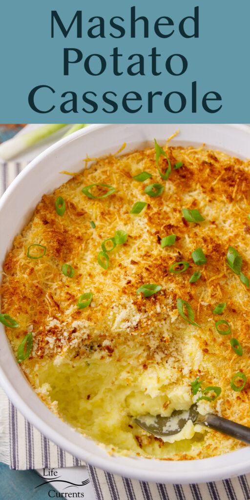 Looking down into a dish of Mashed Potato Casserole with a serving taken out of it.