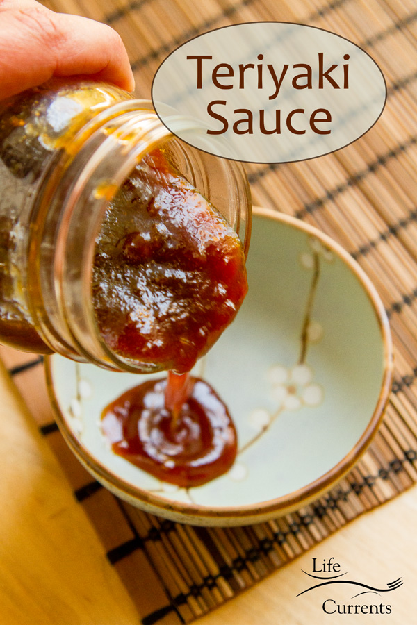 Pouring teriyaki sauce into a blue dish.