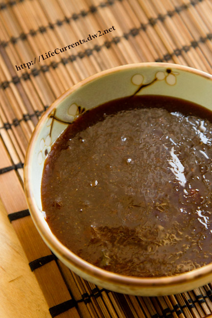 small dish with brown sauce in it.