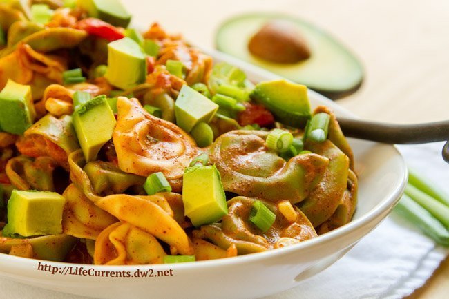 Pasta with avocados and sauce.