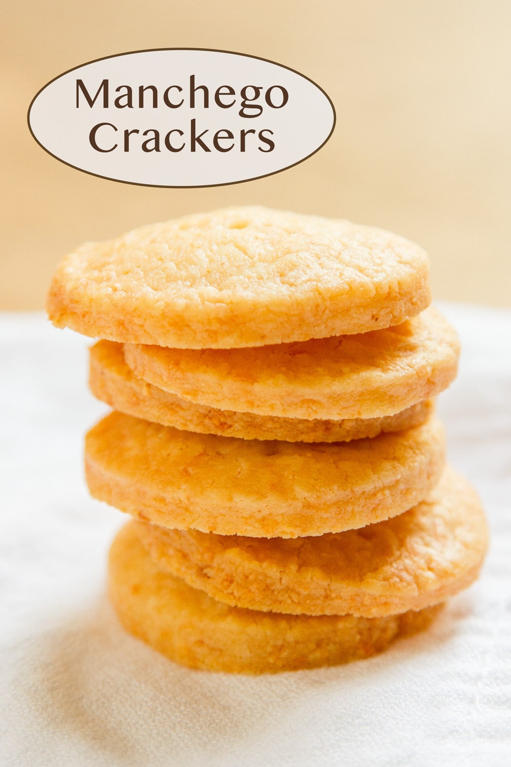 crackers stacked on top of themselves on a white cloth.