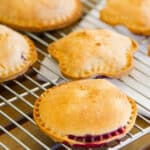 blackberry pies on a cooling rack.