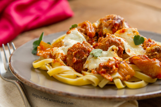 Baked Meatballs in Balsamic Tomato Sauce.. a full flavored rich tomato sauce, topped with melty gooey fresh mozzarella, it’s Italian food, kicked up a notch or two! meatballs on pasta.