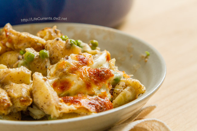 A bowl full of casserole. 