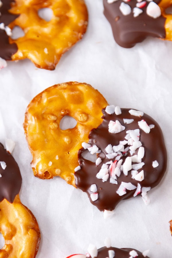 close up on a pretzel covered in chocolate and peppermint candies.