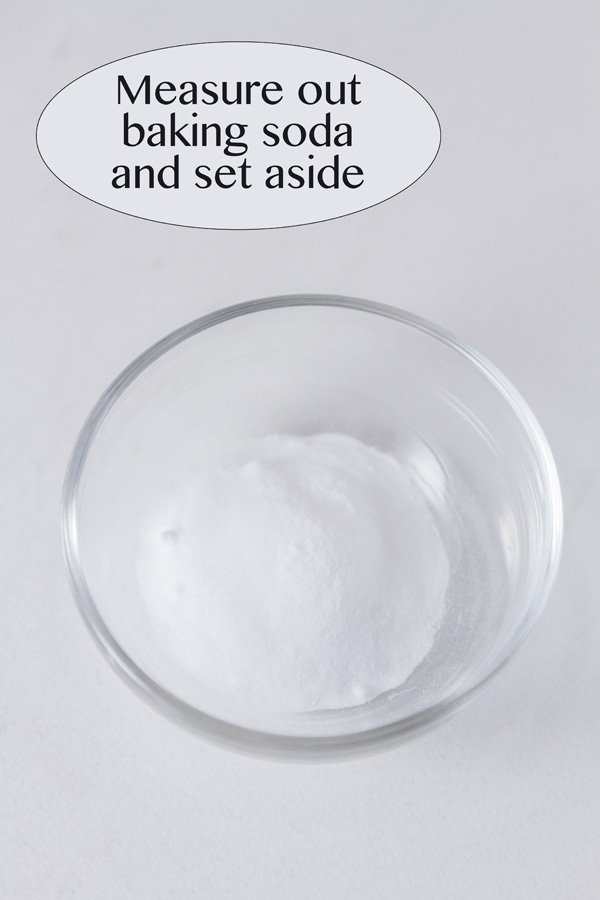 a small bowl of baking soda measured out and ready to use