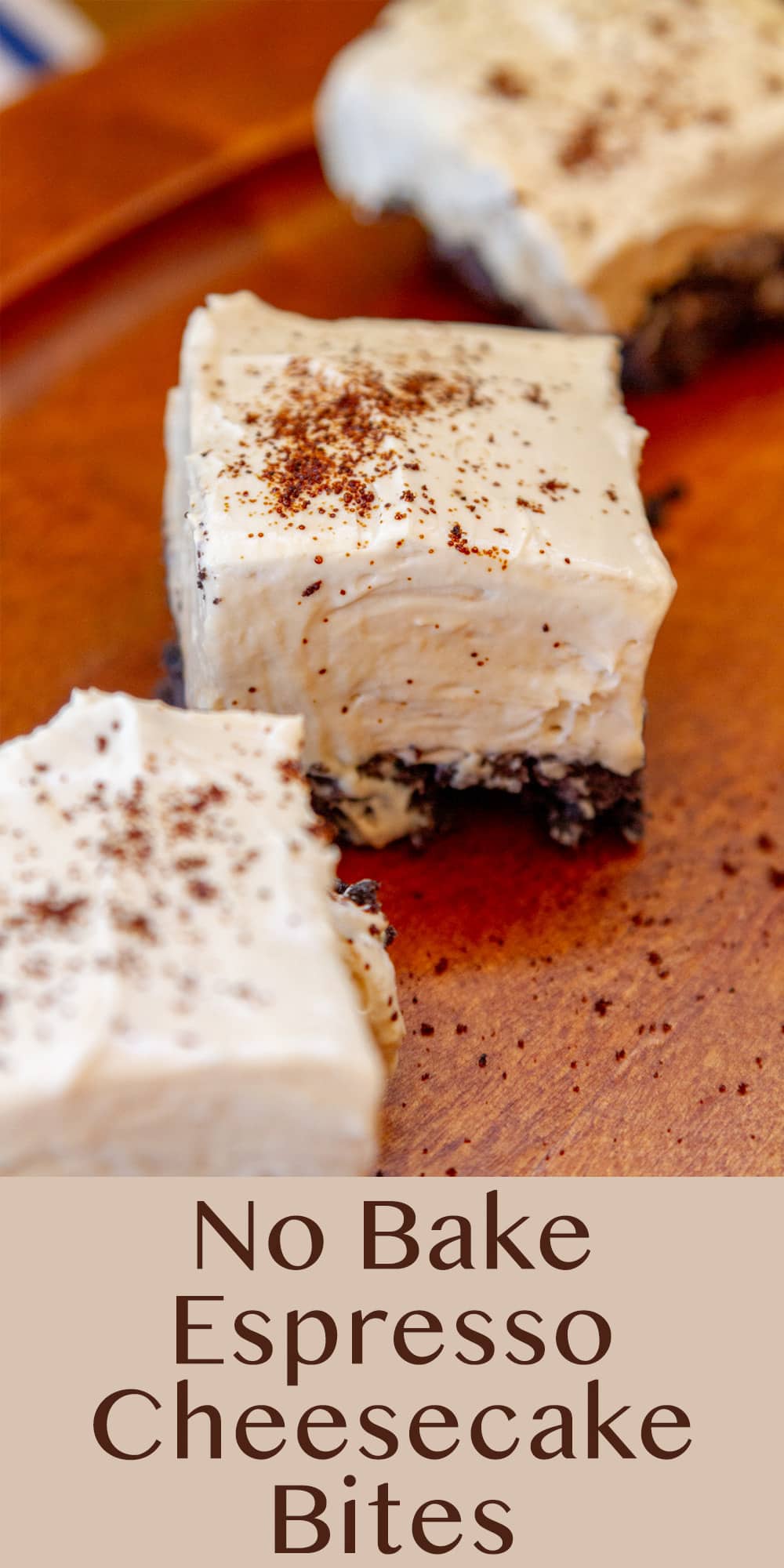 three No Bake Espresso Cheesecake Bites on a wooden serving plate with a blue and white striped cloth behind them.
