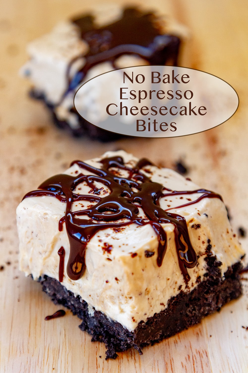 Two No Bake Espresso Cheesecake Bites drizzled with chocolate on a wooden serving board.