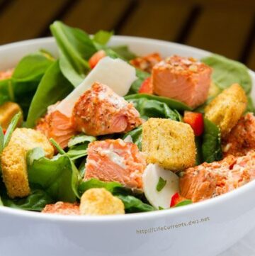This Salmon Caesar Salad is the perfect way to use leftover cedar plank grilled salmon. And, talk about good-for-you! Fresh spinach. Fresh salmon. All kinds of goodness going on in this Salmon Caesar Salad!