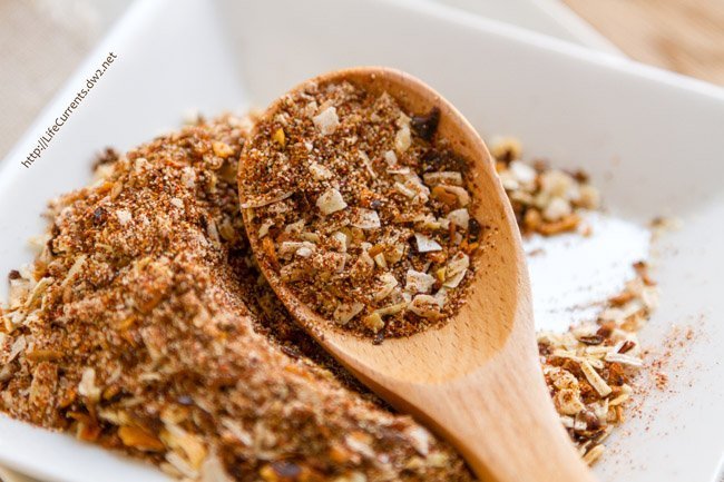 spices on a plate and in a wooden spoon 