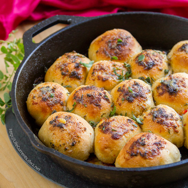 October is Tailgating Snacks Month 2016 - Skillet Pizza Bombs are loaded with yummy pizza fillings and topped with herbed garlic butter, then baked to yummy goodness