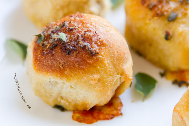 These Skillet Pizza Bombs are so much fun! Soft rolls of pizza dough surrounding your favorite pizza fillings, baked to pizza-goodness, and topped with garlic herb butter. Yum! These didn't last long in our house, that's for sure! 