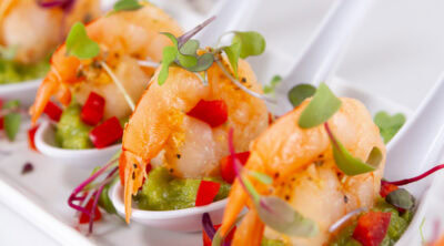square crop of guacamole shrimp in Chinese soup spoons appetizer.