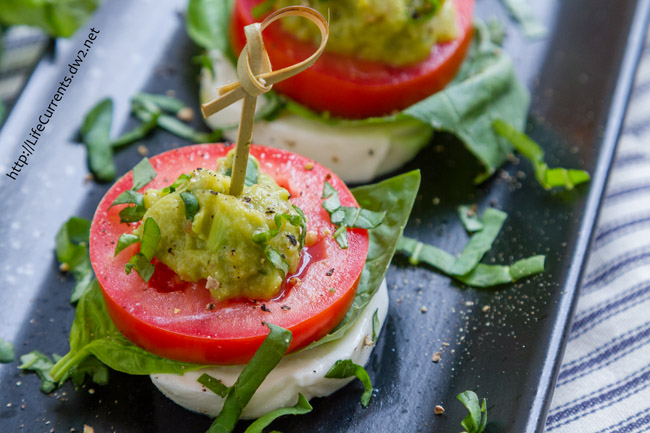 Super easy to make, and Caprese is one of my favorite combinations of flavors (mmm, fresh mozzarella, tart tomatoes, fresh basil - yum!), these Guacamole Caprese Bites will be the toast of the party!