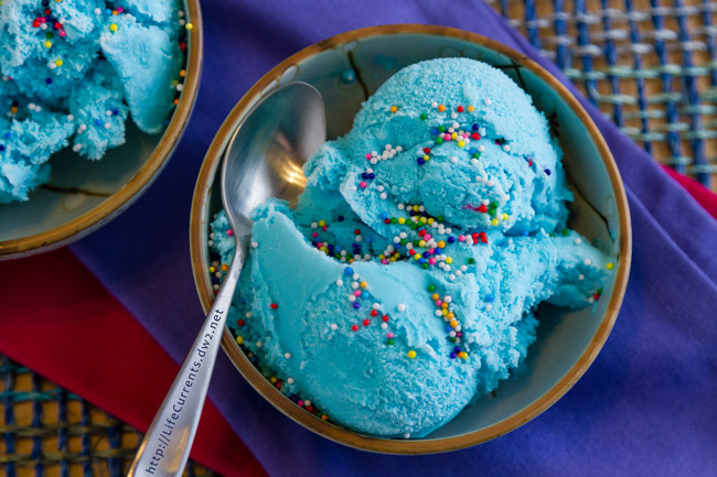 a bowl of ice cream and it's blue in color.