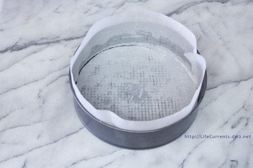 Lemon Souffl&eacute; Cheesecake - parchment paper lined pan 