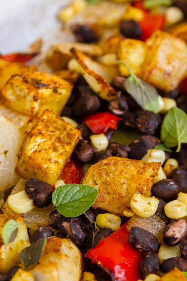 close up on southwestern roasted vegetables or sweet potato, black beans, corn, and red pepper.