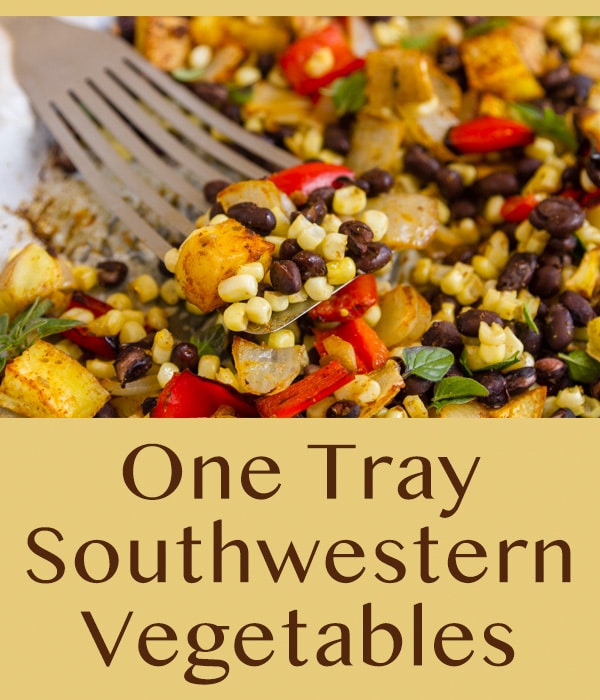 a spatula picking up vegetables out of a white casserole dish.