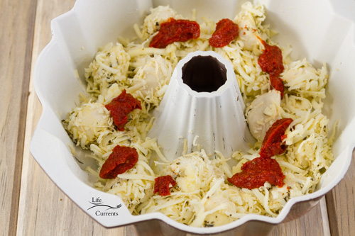 Pizza Pull Apart Bread Recipe being made in the bundt pan Pizza Pull Apart Bread Recipe being made in the bundt pan.