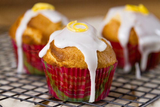 Lemon Glazed Sugar Muffins for afternoon snack or breakfast Lemon Glazed Sugar Muffins -Lemon glaze dripping over sugar muffins waiting to be grabbed