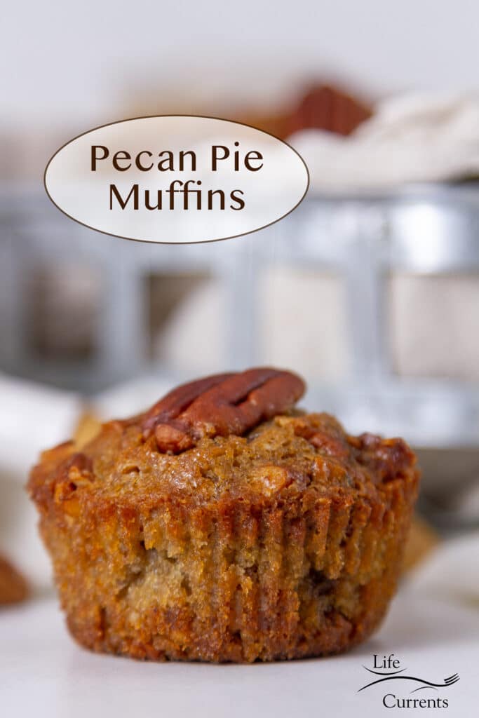 a pecan pie muffin in front of a metal basket holding more muffins.