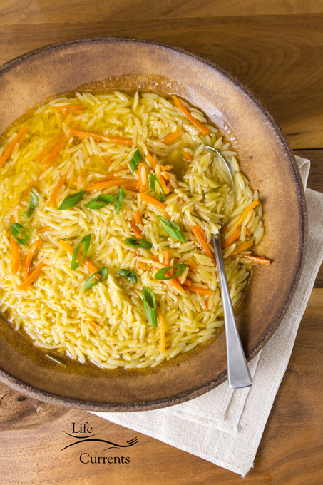 Rosemary Orzo Soup - It&rsquo;s easy. It&rsquo;s delicious. And, it&rsquo;s a healthy meal. And, one that I can add in a bunch of veggies if I want. vertical image with spoon