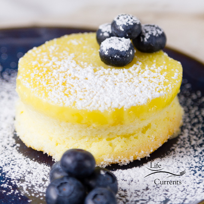 These Lemon Souffl&eacute; Magic Cakes are light and airy sponge cakes topped with a lemon curd pudding. And, all you had to do was make one batter that magically separates while it bakes! 