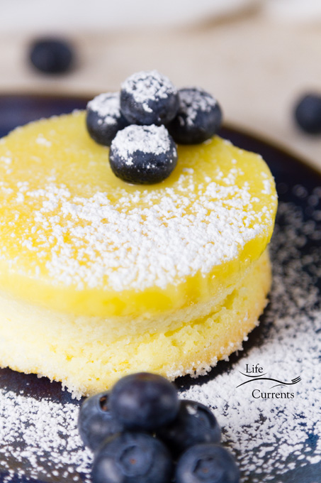 Lemon Souffl&eacute; Magic Cakes are light and airy sponge cakes topped with a lemon curd pudding - one batter that magically separates while it bakes! 