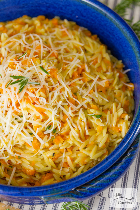 Cheesy One Pot Carrot Orzo Side Dish Recipe in a bright blue bowl ready to serve