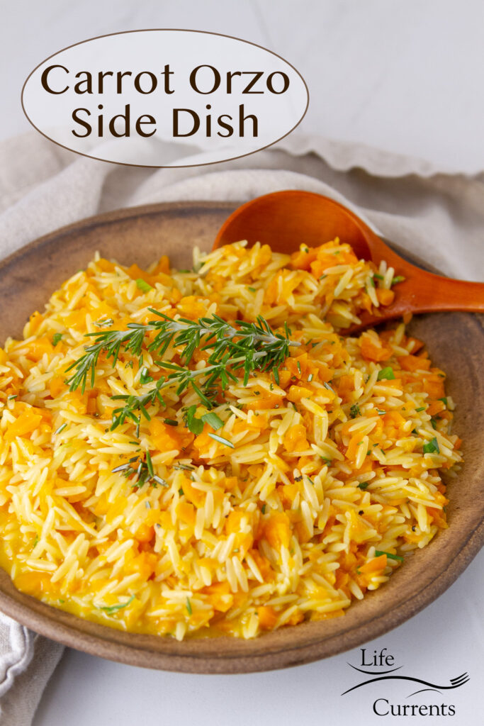 A bowl of carrot orzo side dish with a wooden serving spoon, title in upper left.